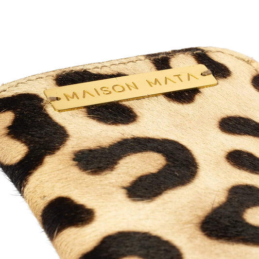 Engraved brass Maison Mata plate on the Sauvage leopard softcase