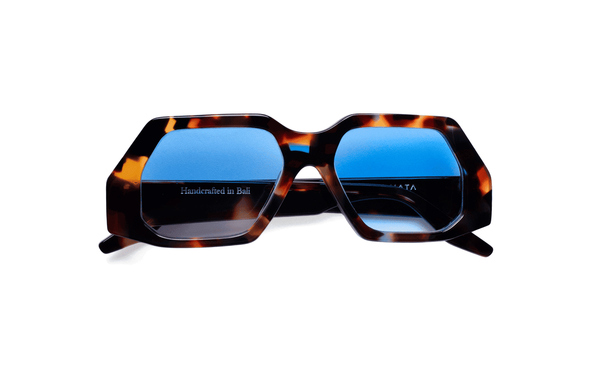Maison Mata Mahogany mirage tortoiseshell acetate oversized sunglasses, three-quarter view with blue gradient lenses