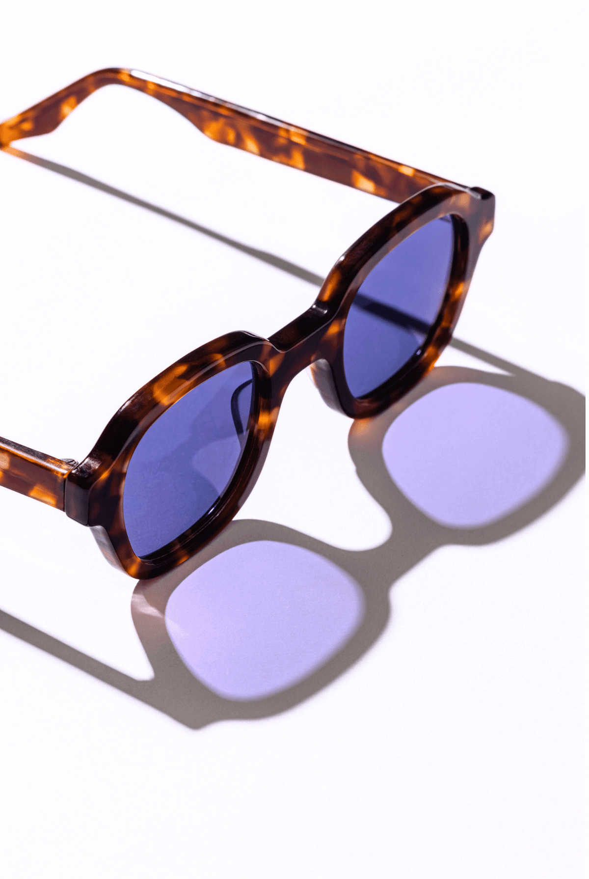 Maison Mata polarized sunglasses made in Bali, frame photographed in a play of light and shadow
