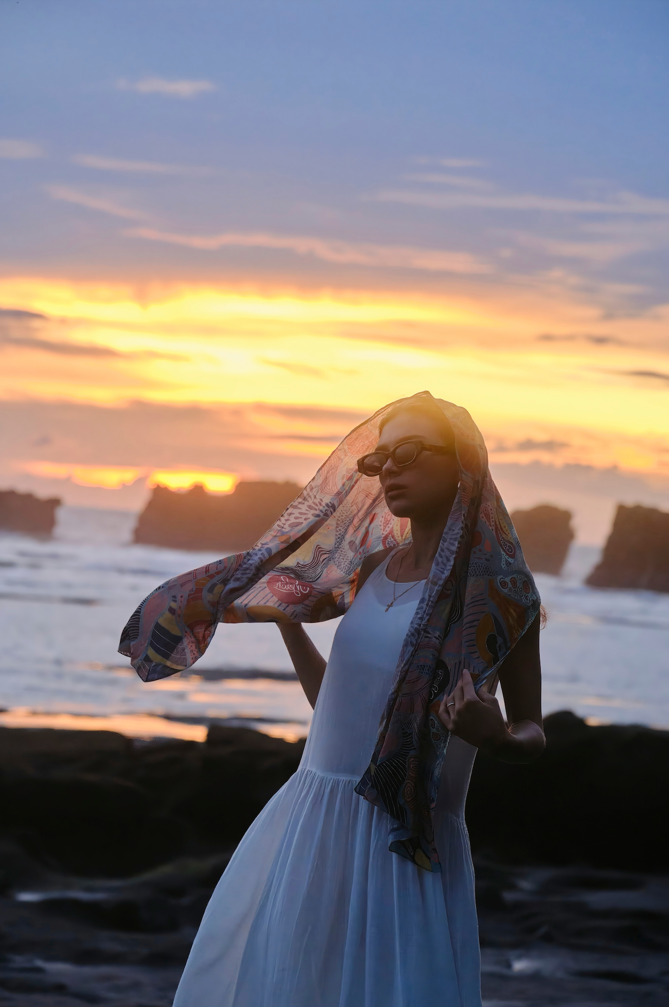 Handmade polarized sunglasses worn by a woman on Canggu beach in Bali refined by Maison Mata opticians.