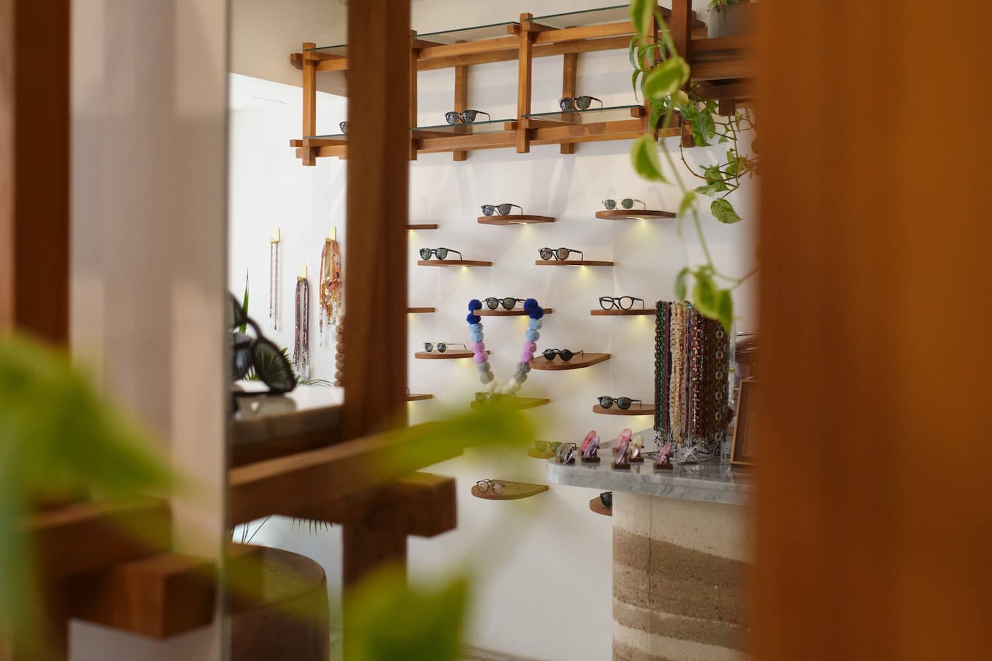 Wooden shelves and glasses chains in the Ubud boutique