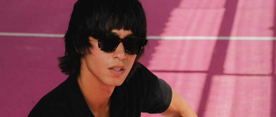 Man wearing dark Maison Mata acetate sunglasses under strong Bali sunlight