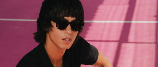 Man wearing dark Maison Mata acetate sunglasses under strong Bali sunlight