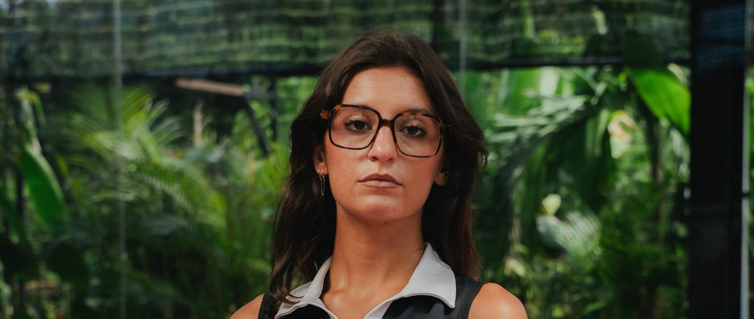 Woman wearing clear Maison Mata optical glasses in natural daylight in Bali