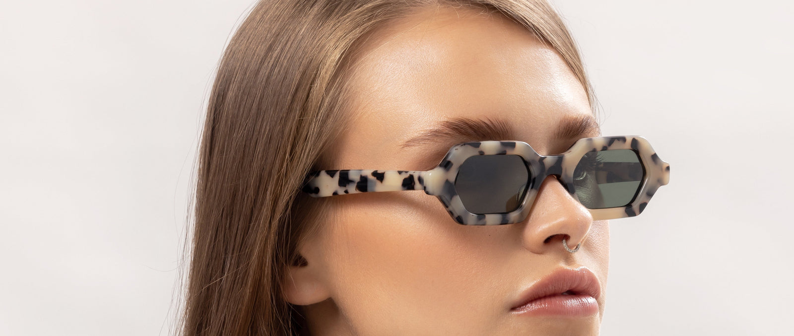 Woman wearing Maison Mata sunglasses in bright daylight, category 3 tinted lenses