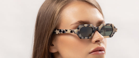 Woman wearing Maison Mata sunglasses in bright daylight, category 3 tinted lenses