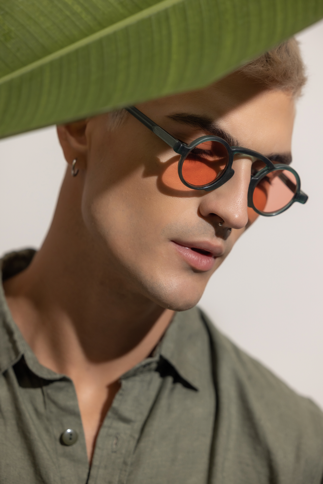Man wearing a lightweight acetate frame fitted for comfort in a Bali workshop