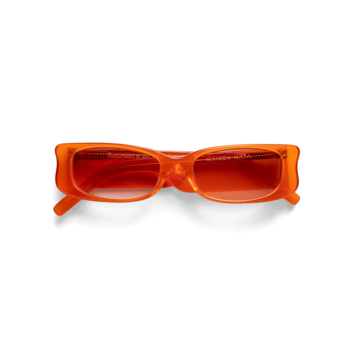 Maison Mata Muse translucent orange acetate rectangular sunglasses, three-quarter view