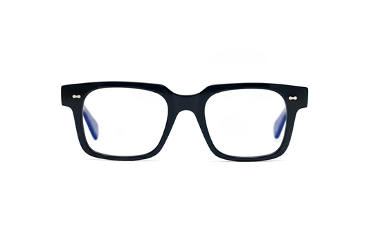 Black square optical glasses with blue-light protection fitted by Maison Mata opticians.