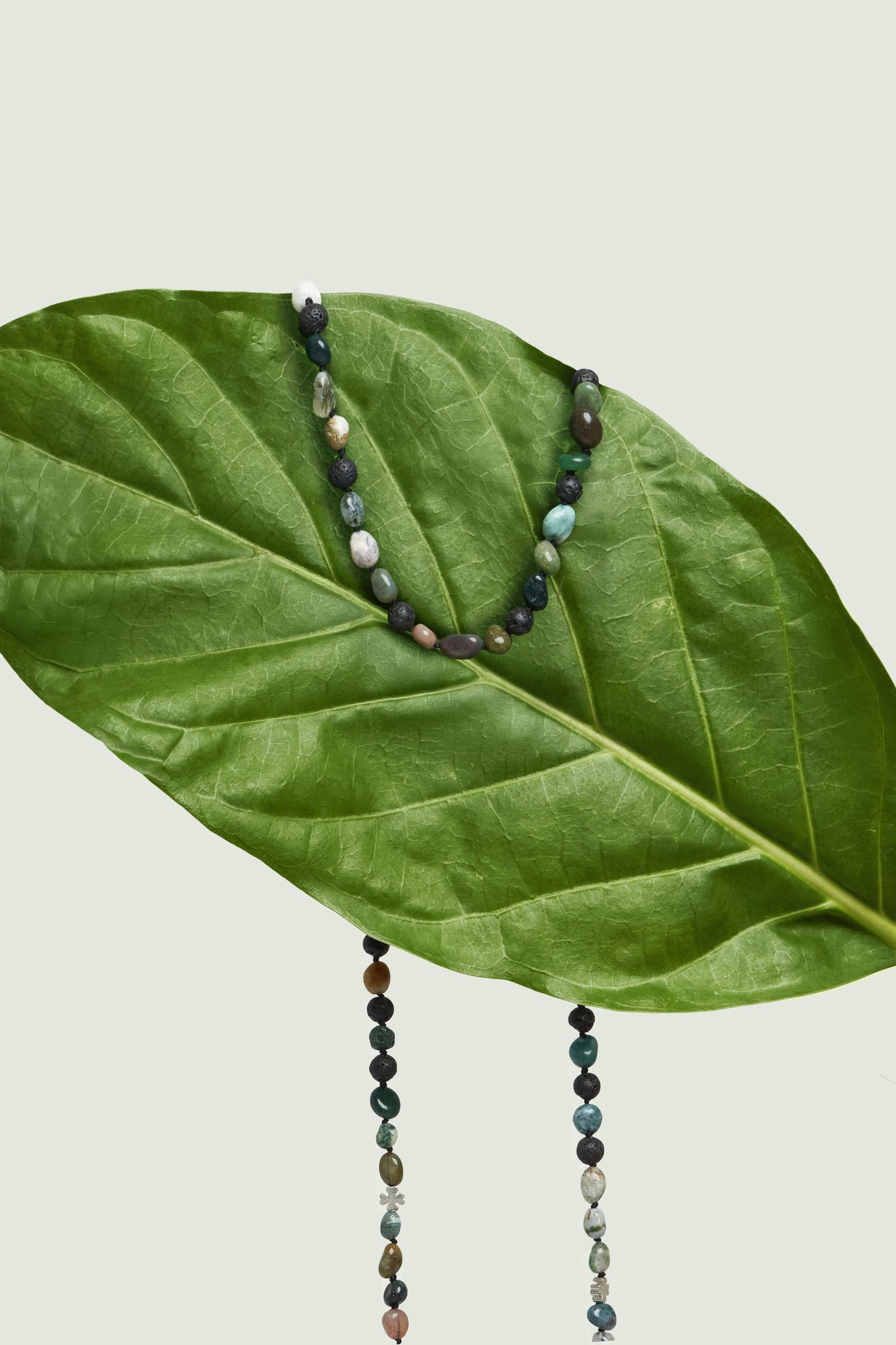 Delicate women’s gold chain for sunglasses, handmade with semi-precious details in Bali.