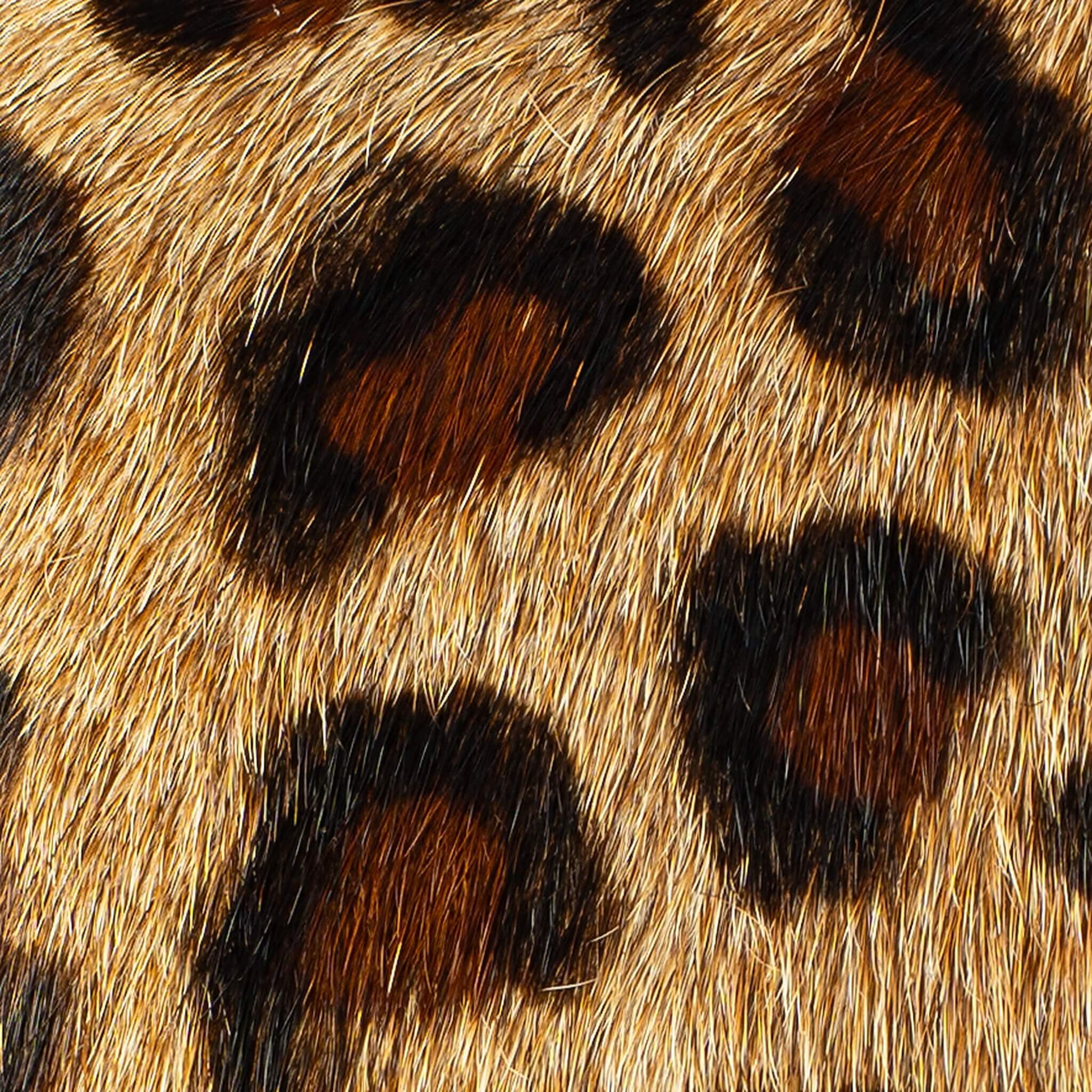 Close-up of the hair-on hide on the Maison Mata brown leopard softcase