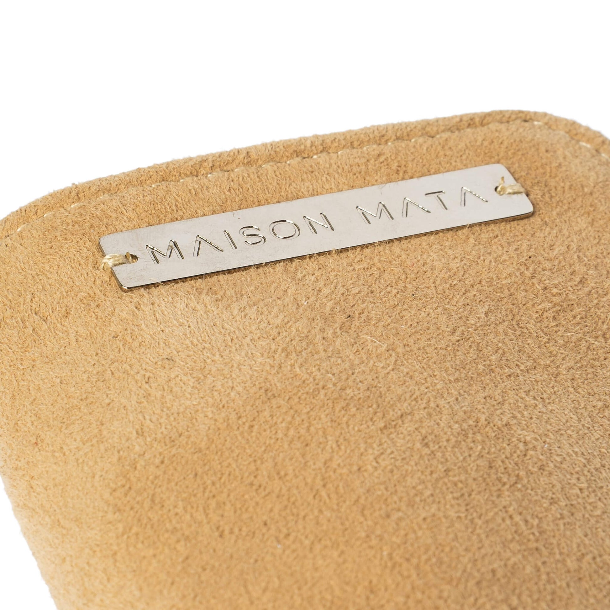 Engraved silver Maison Mata plate on the latte suede softcase