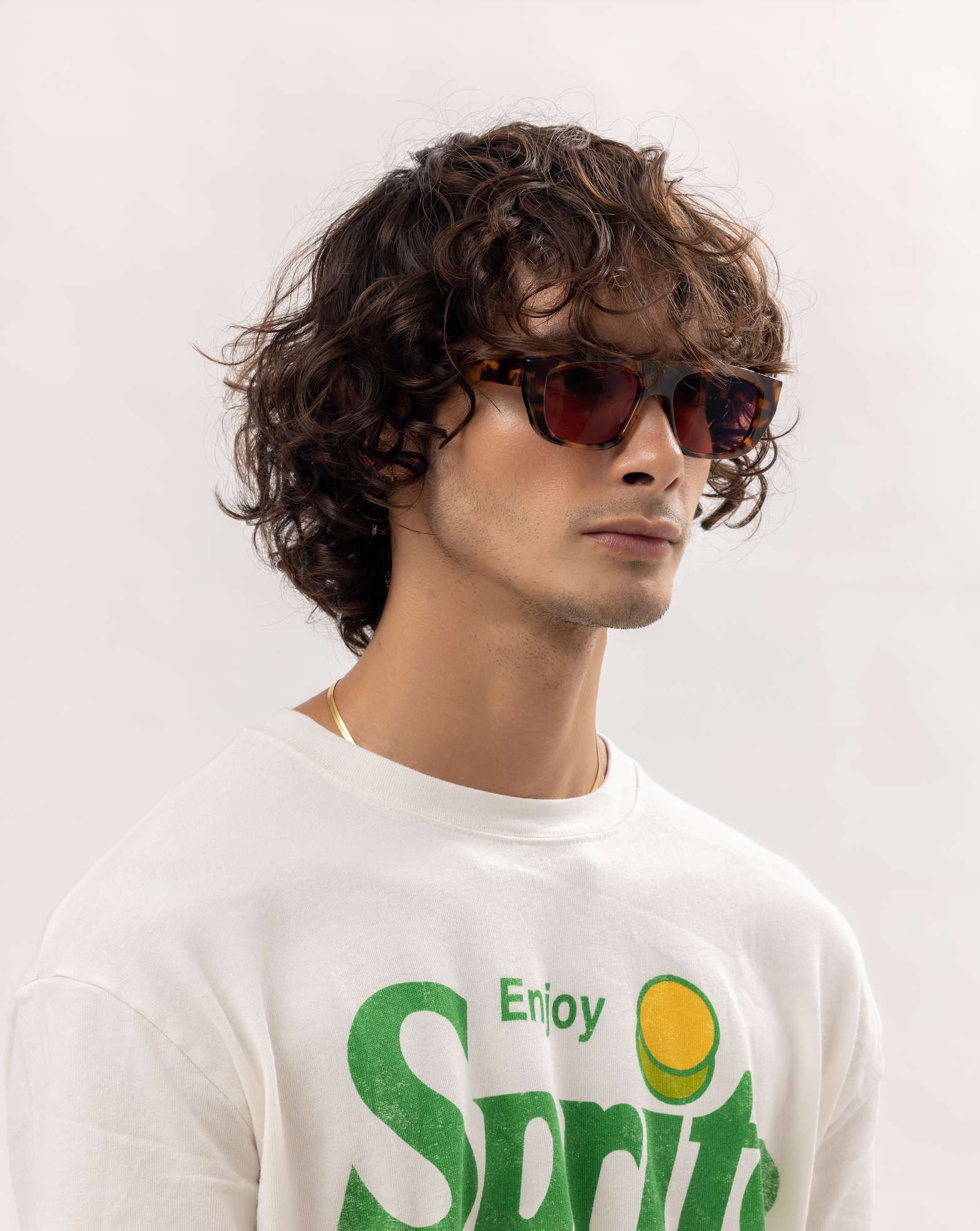 Elegant handmade polarized sunglasses Maison Mata worn by a man transitioning from studio shoot to Bali villa calm.