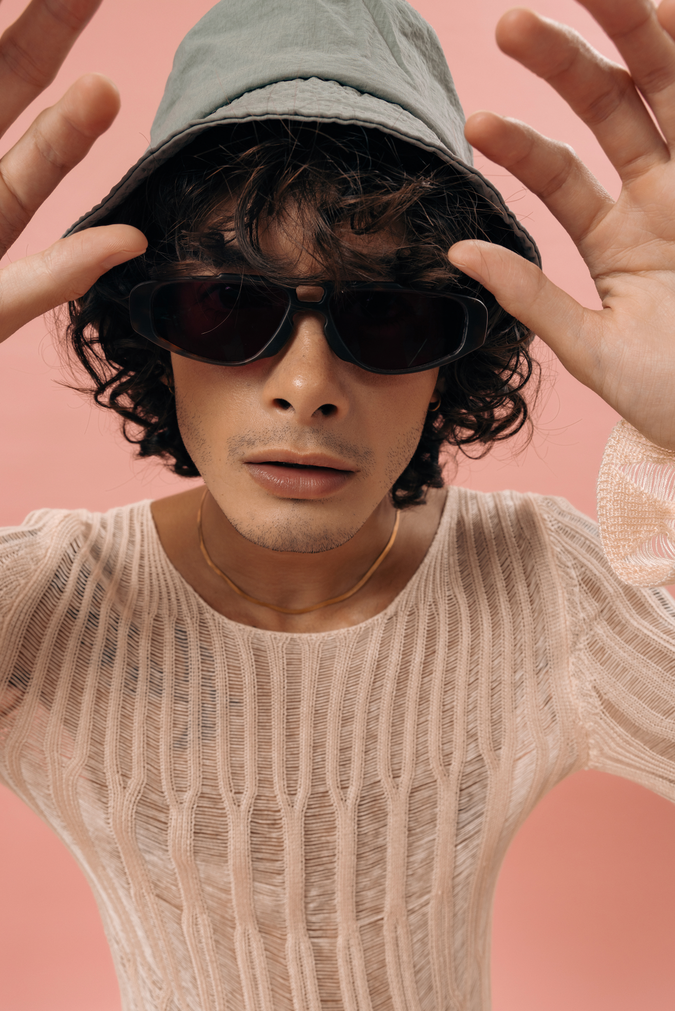 Man wearing handmade polarized sunglasses by Maison Mata captured in studio lighting with Bali optician expertise.