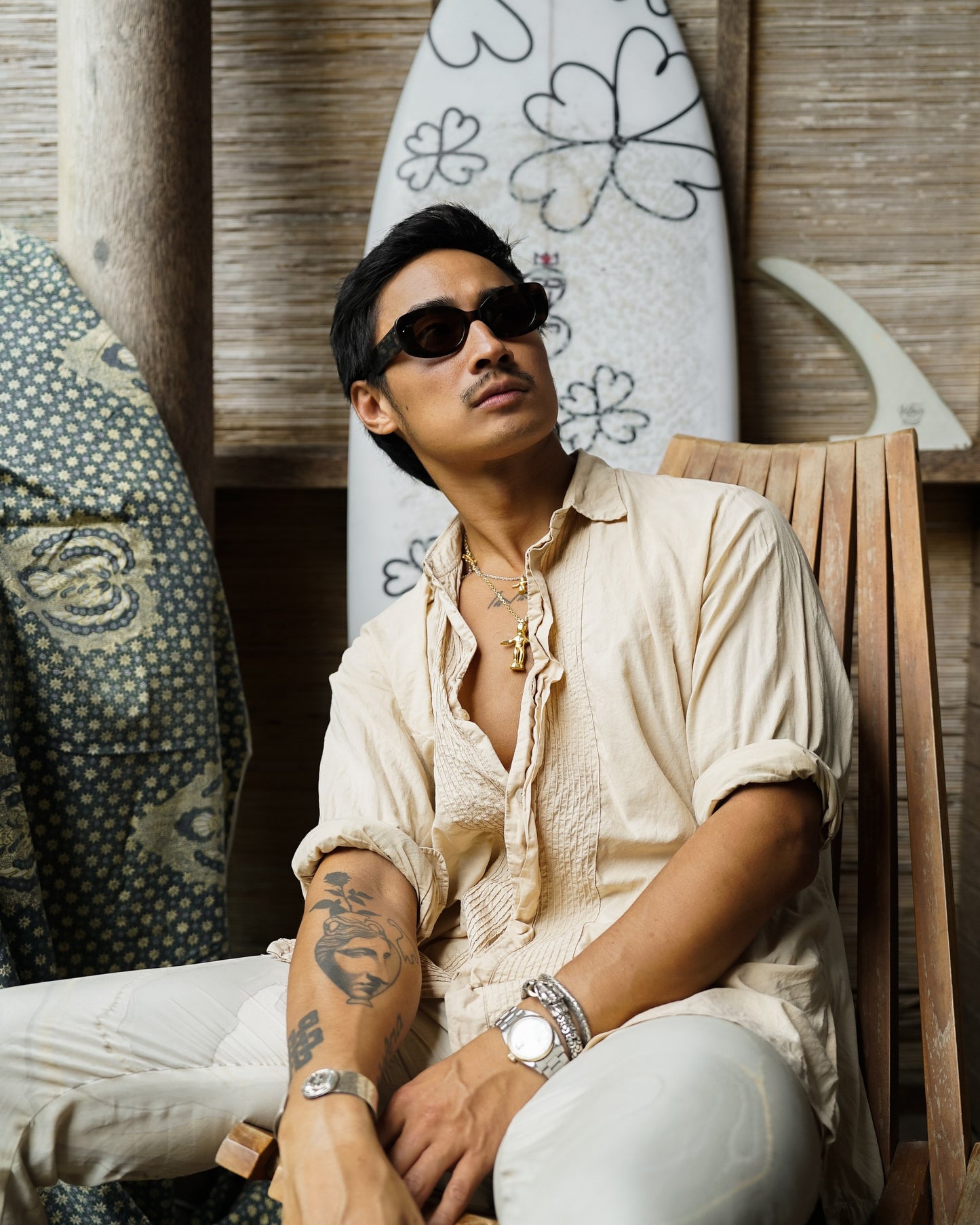 Man wearing Bali Blue Midnight Sky black acetate sunglasses in linen