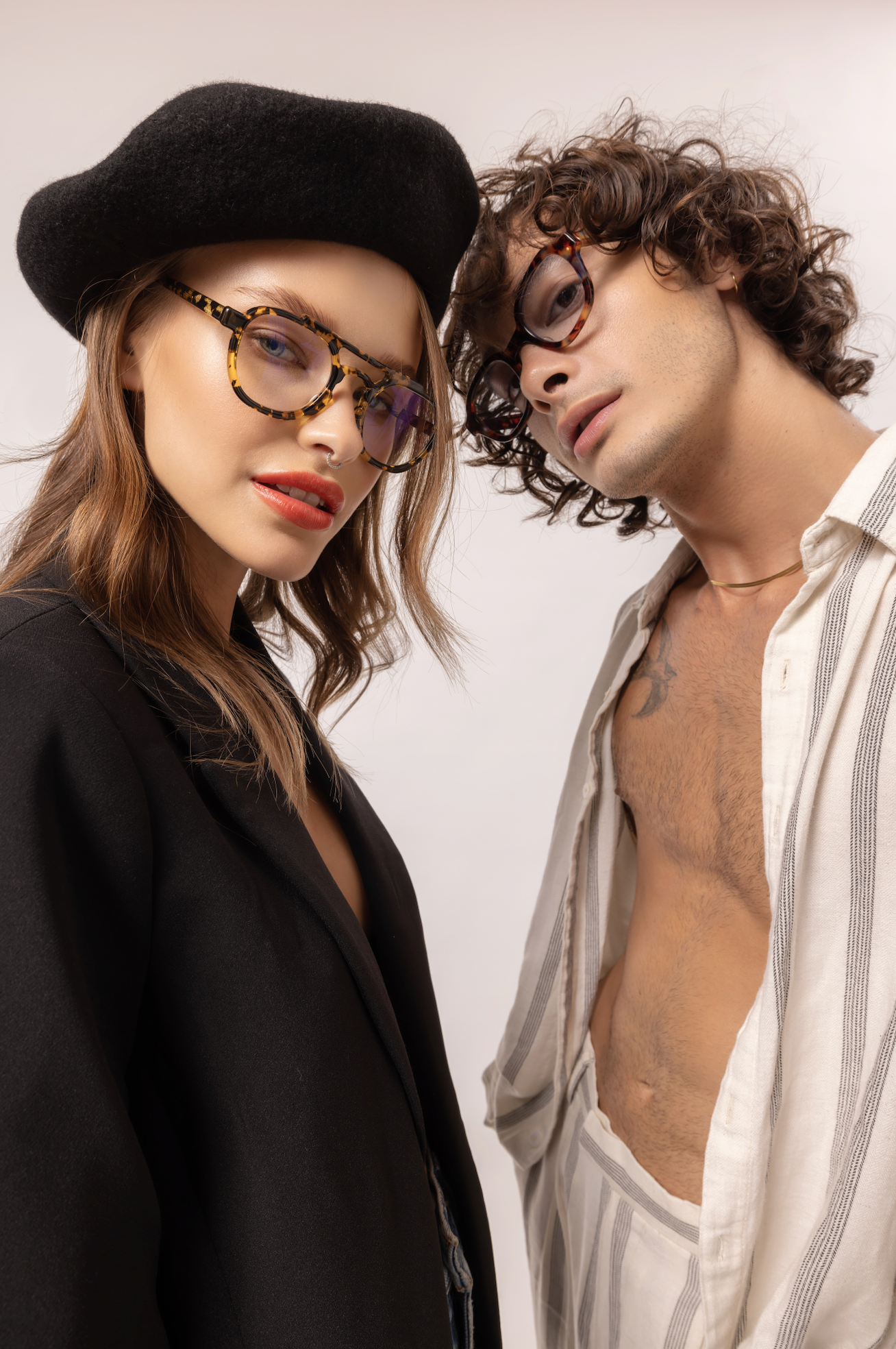 Couple seen wearing handmade acetate sunglasses in Ubud in Bali refined by Maison Mata optometrists for premium eyewear.