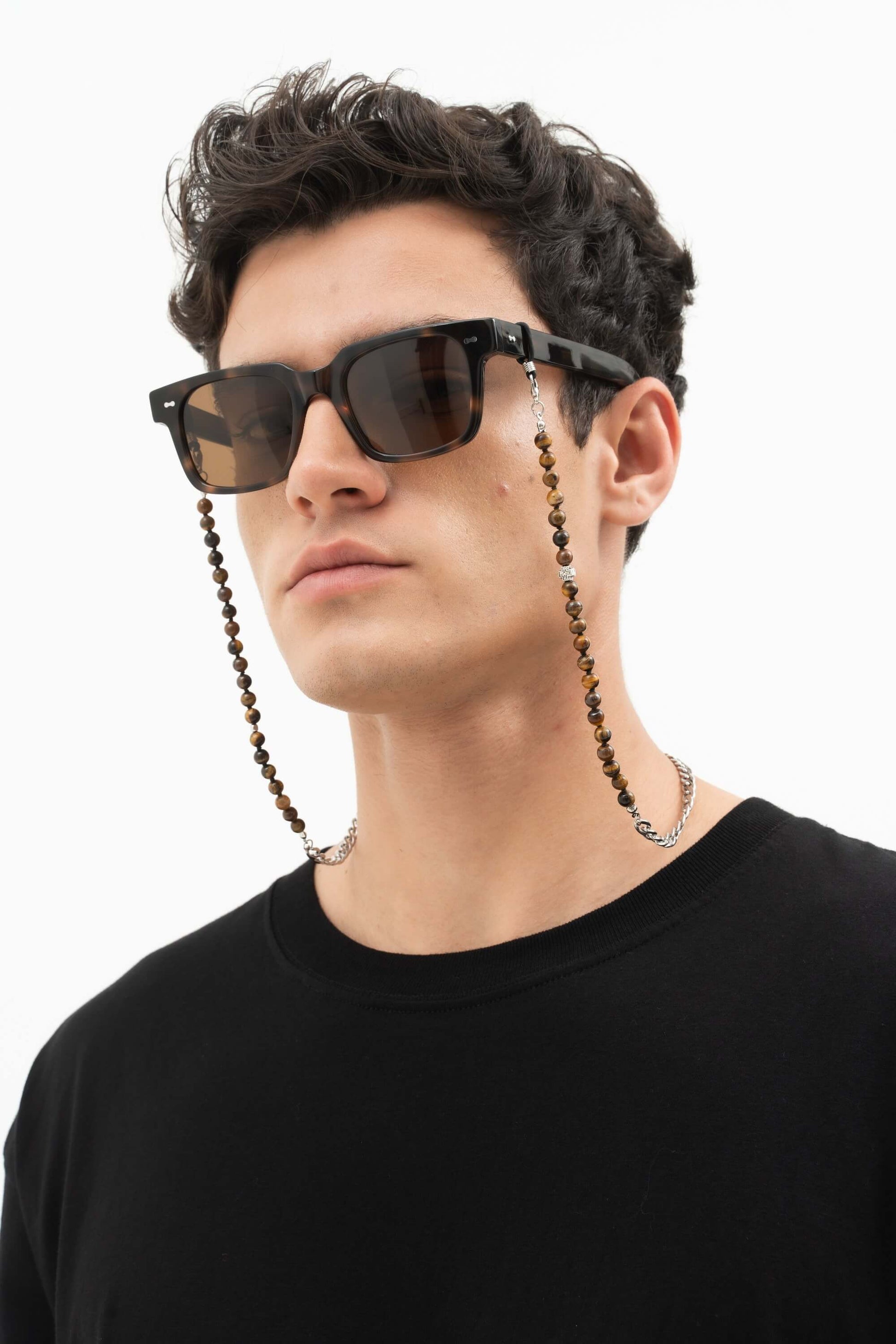 Man in Borneo Bliss Dark Forest rectangular sunglasses and beaded eyewear chain