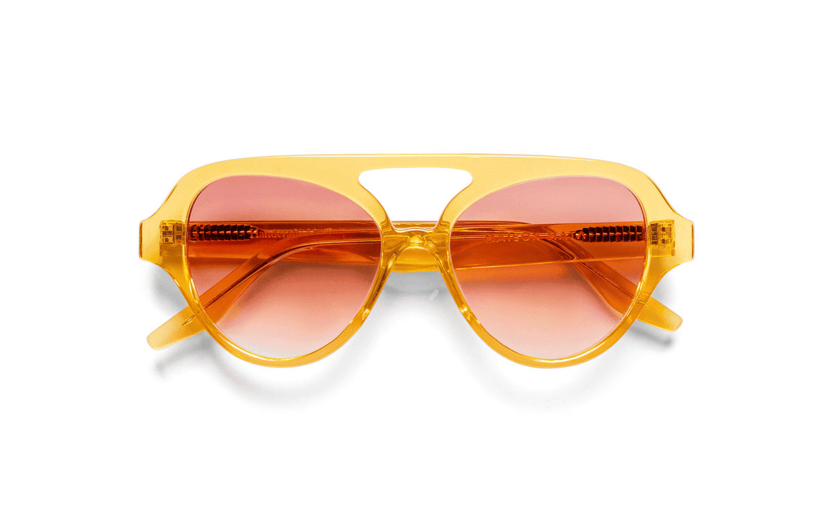 Maison Mata Bumblebee translucent yellow acetate aviator sunglasses, three-quarter view with pink gradient lenses