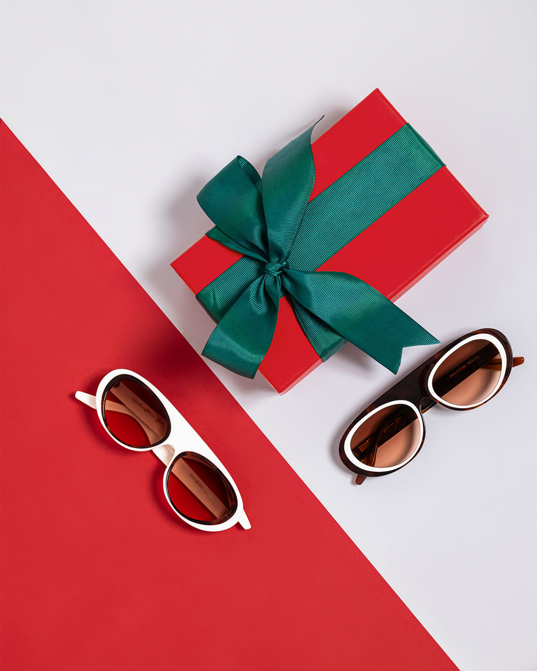 handmade white aviator sunglasses displayed on table with gift – Maison Mata