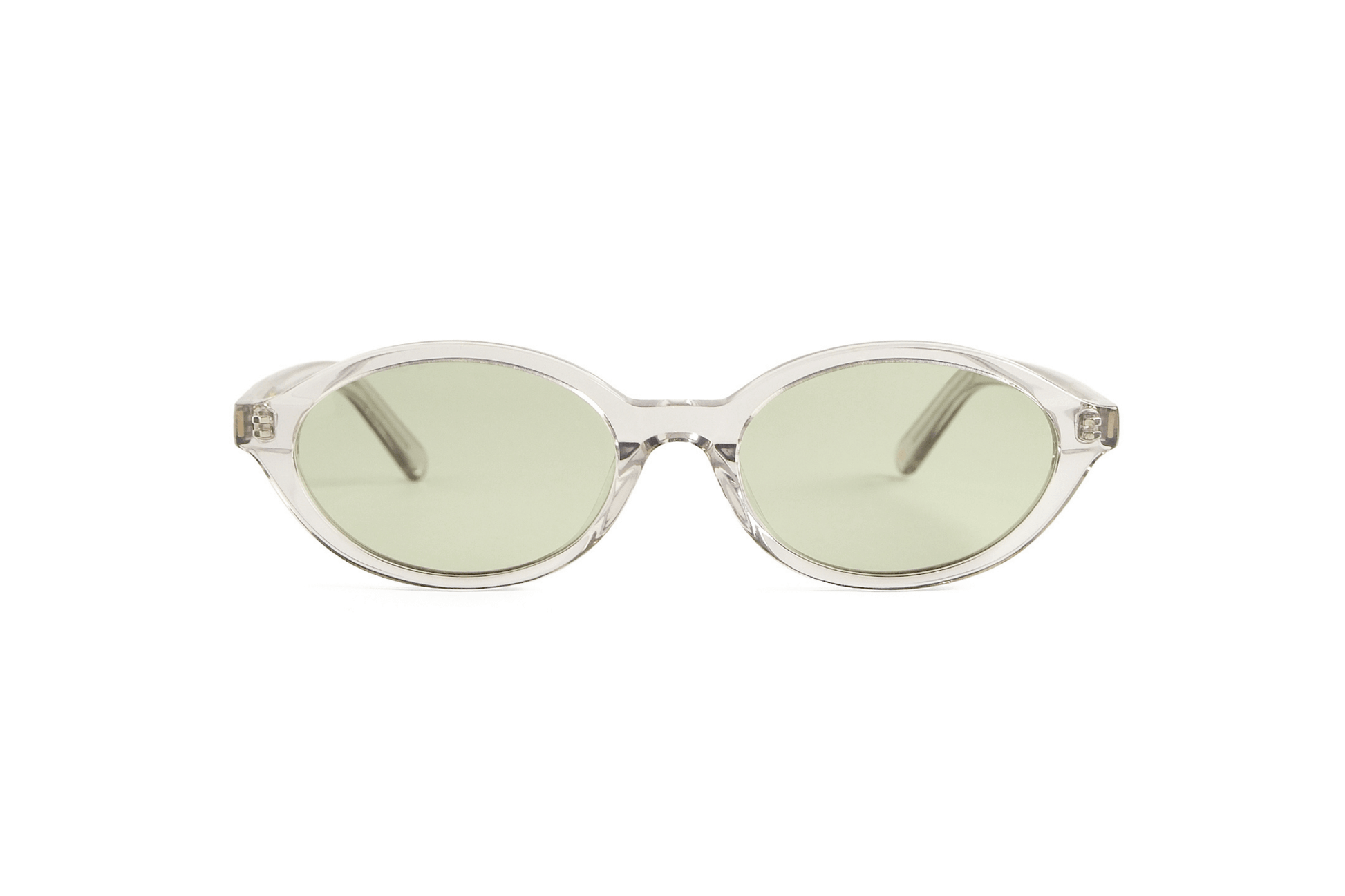 Oval slim tortoise acetate polarized sunglasses adjusted by optometrists in Ubud in Bali for bright tropical wear.