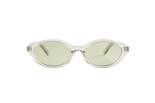 Oval slim tortoise acetate polarized sunglasses adjusted by optometrists in Ubud in Bali for bright tropical wear.