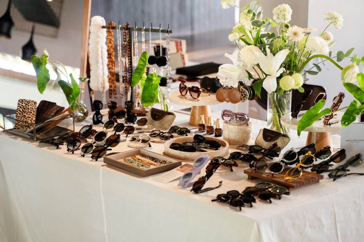 Maison Mata pop-up eyewear display with sunglasses, chains and flowers at a beach club in Bali