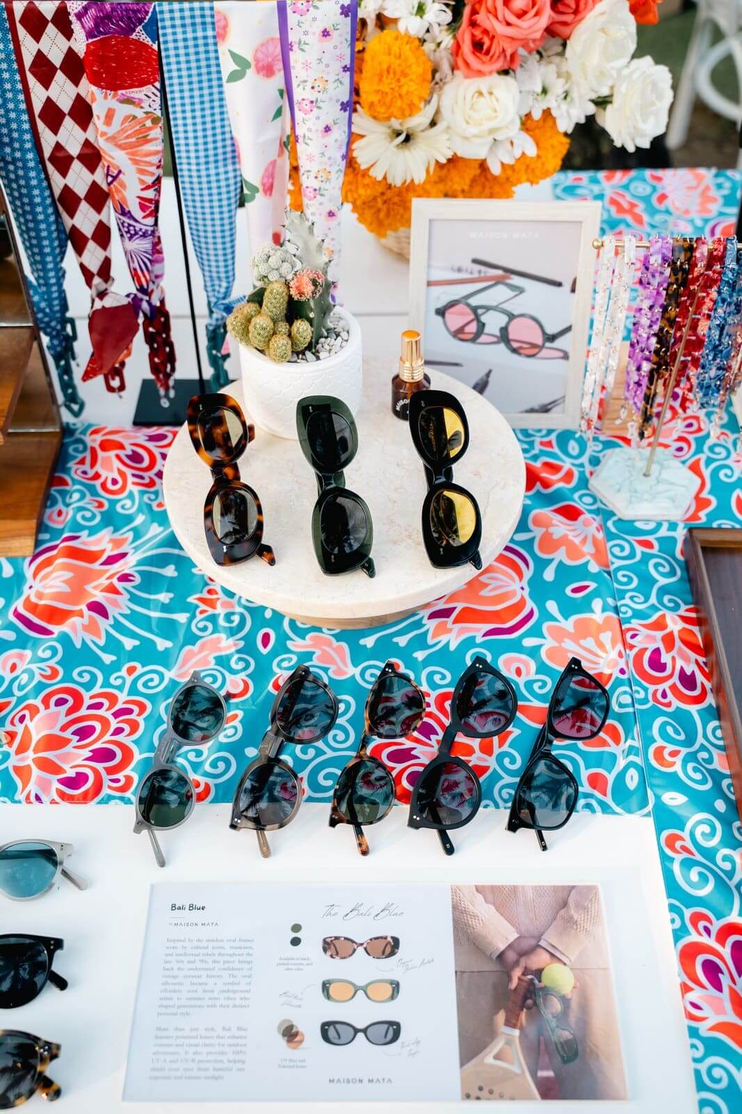 Maison Mata eyewear display on a batik tablecloth at a welcome reception in Bali