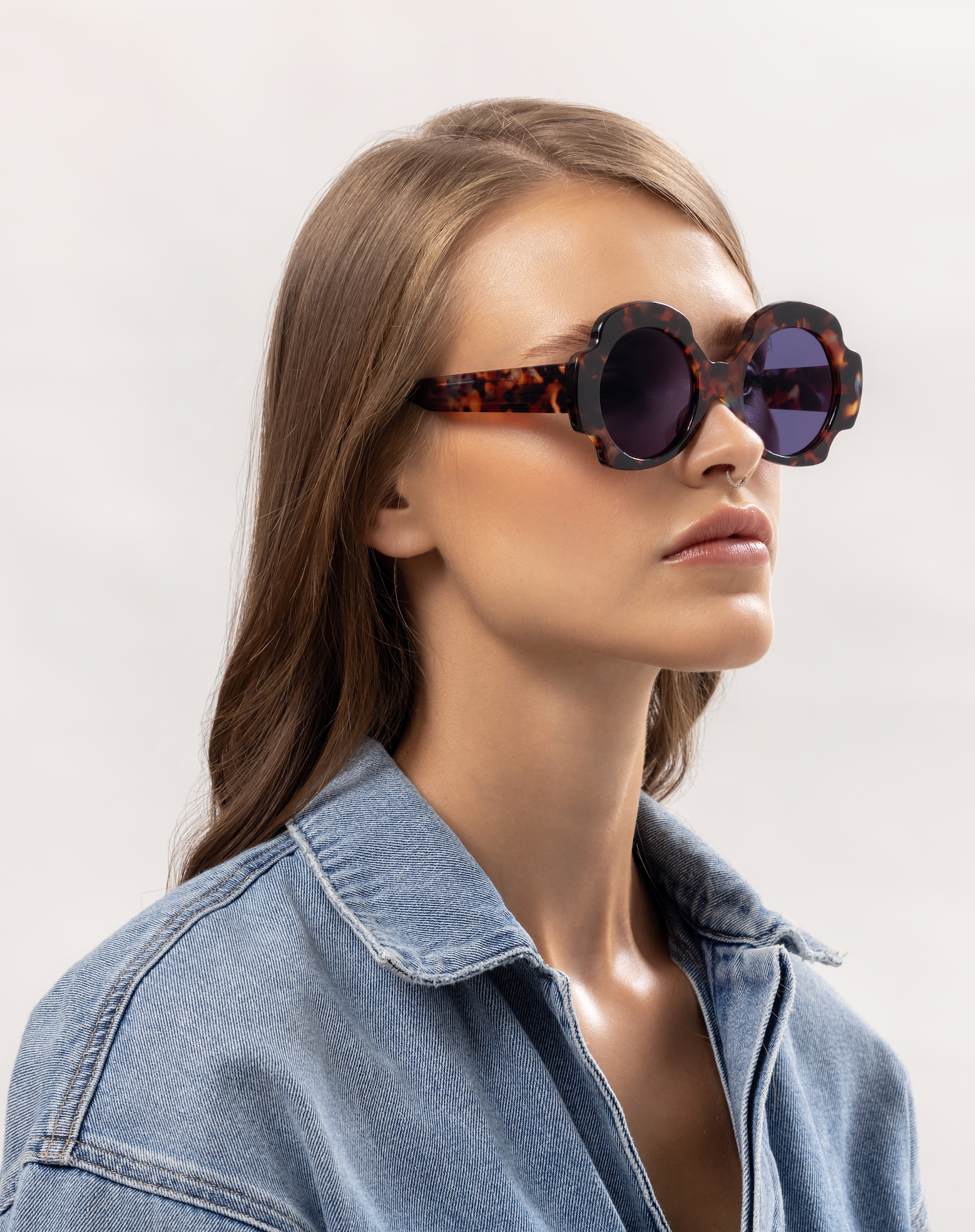 Handmade polarized sunglasses highlighted on a woman in her Bali villa moment perfected by skilled optometrists.