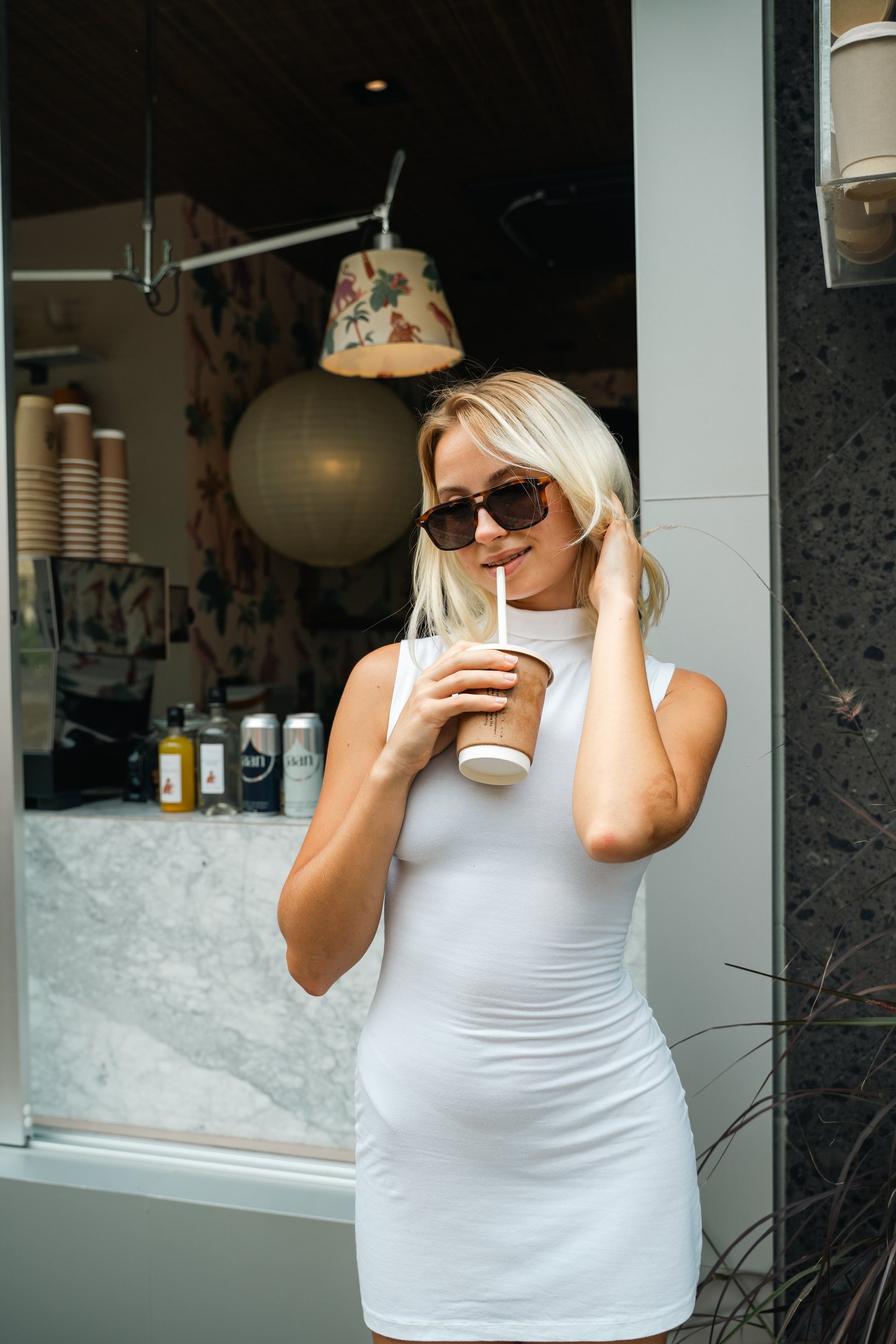 Woman wearing Java Joy Caramel Swirl tortoiseshell aviator sunglasses in Bali