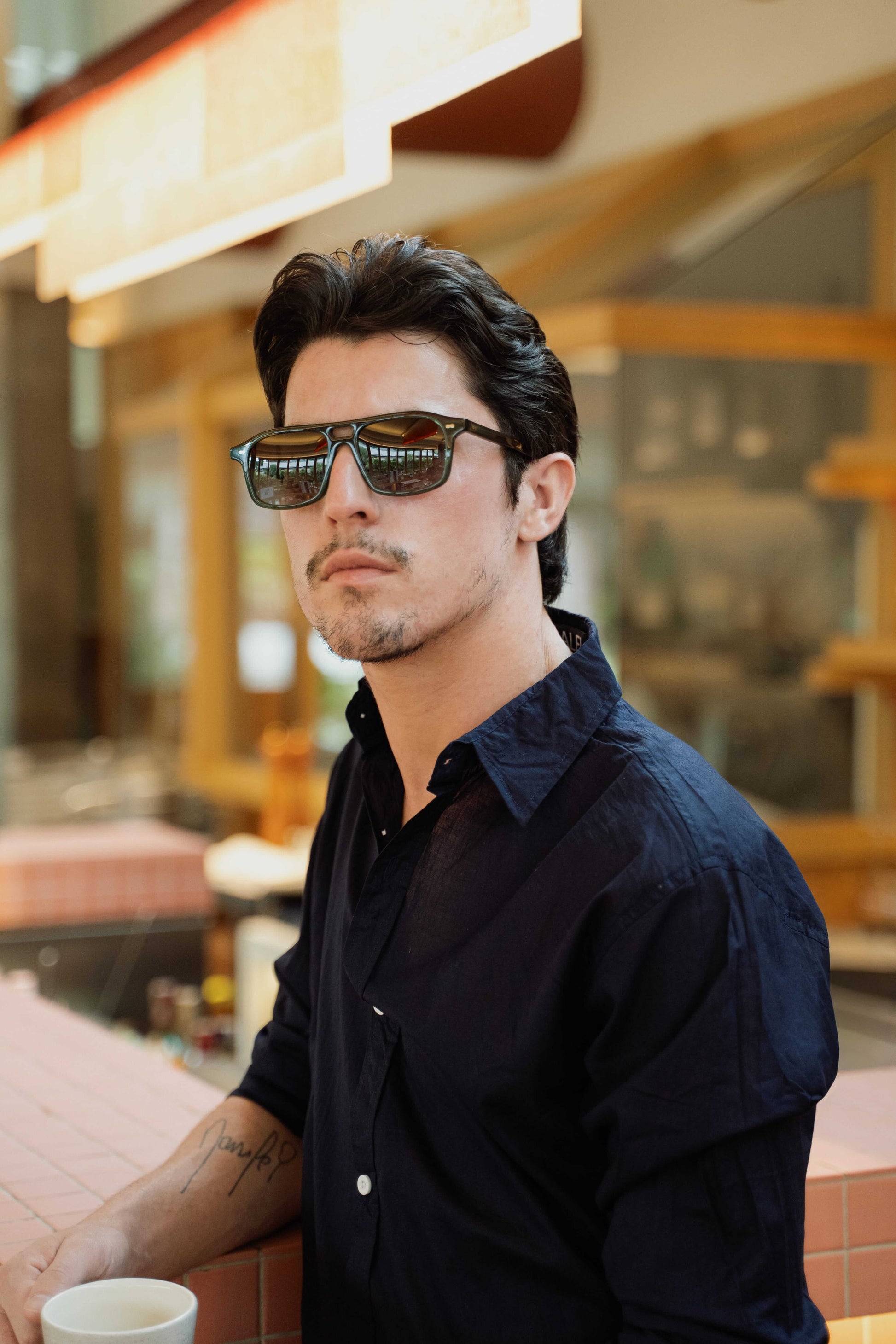 Man wearing Java Joy Olive Gove olive acetate aviator sunglasses in Bali