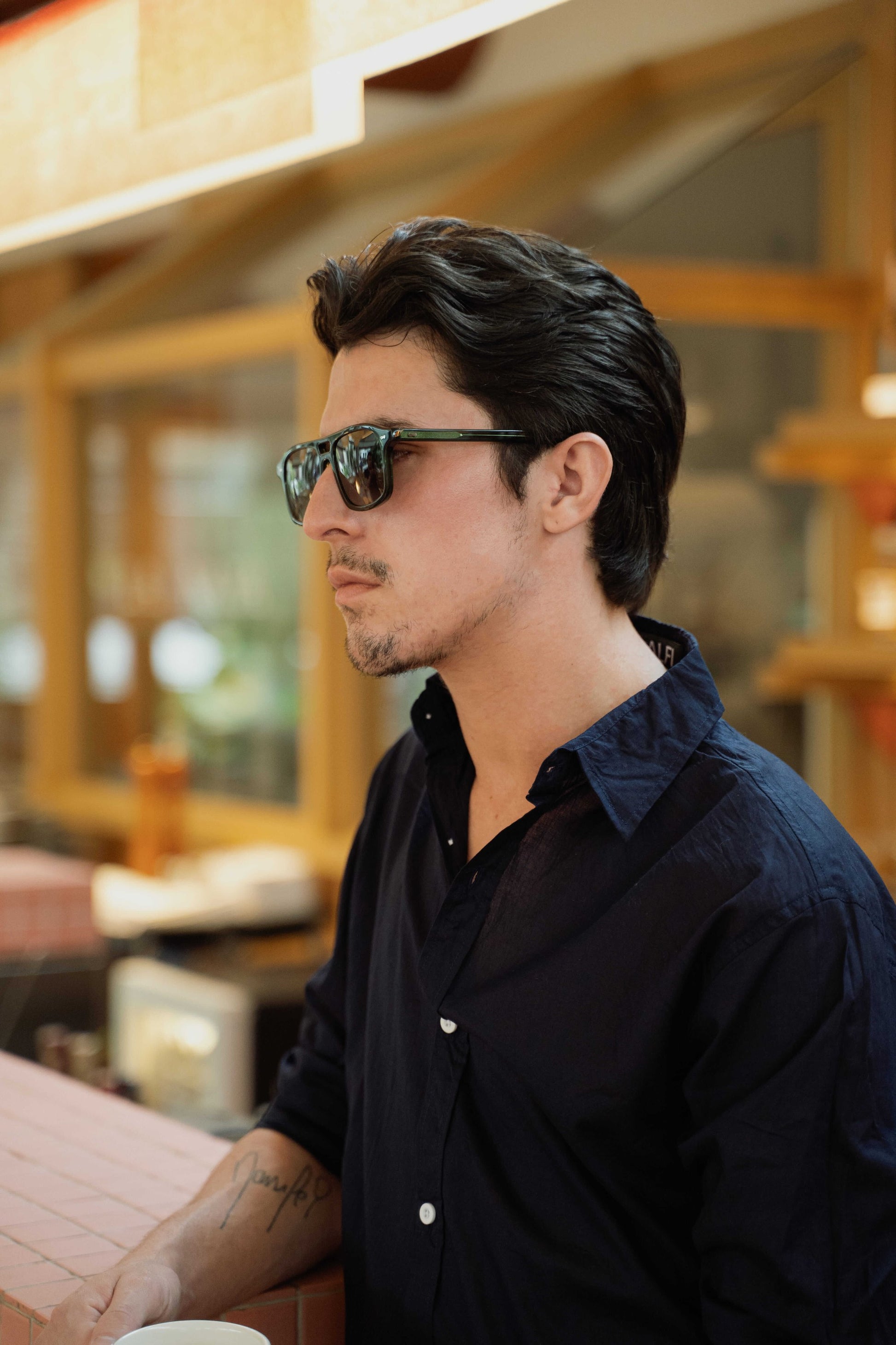 Portrait of man in Java Joy Olive Gove aviator sunglasses Maison Mata Bali eyewear