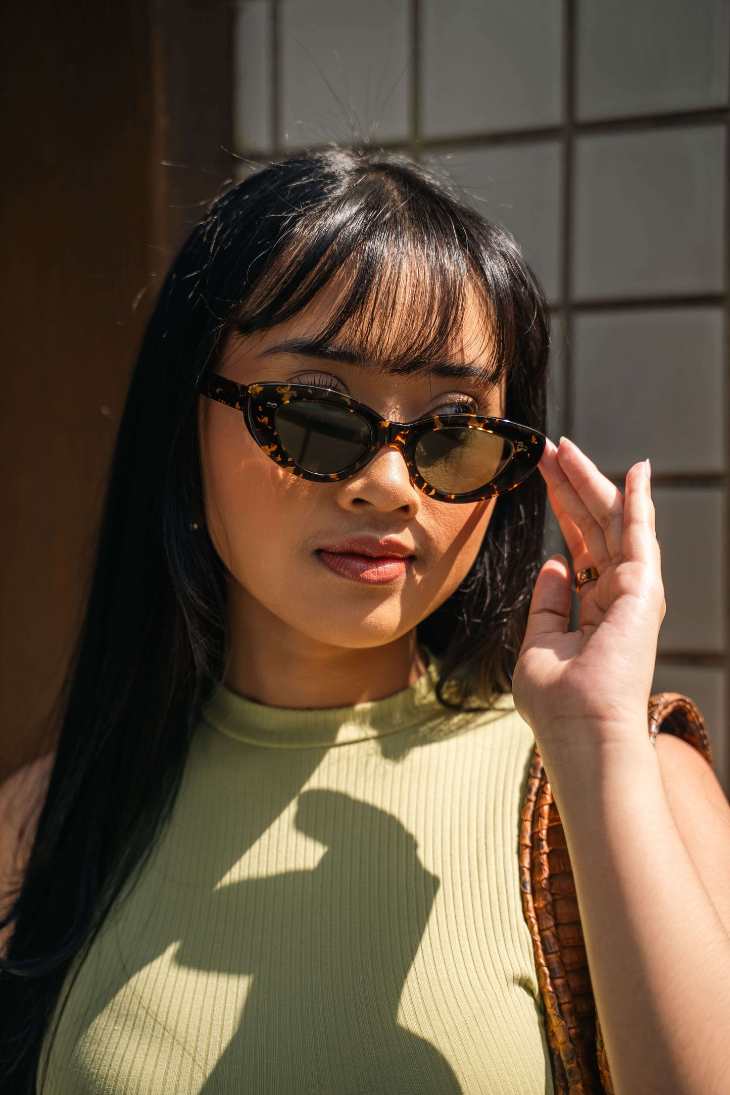 Close-up of Lombok Luxe Black Sun cat-eye sunglasses Maison Mata handmade in Bali