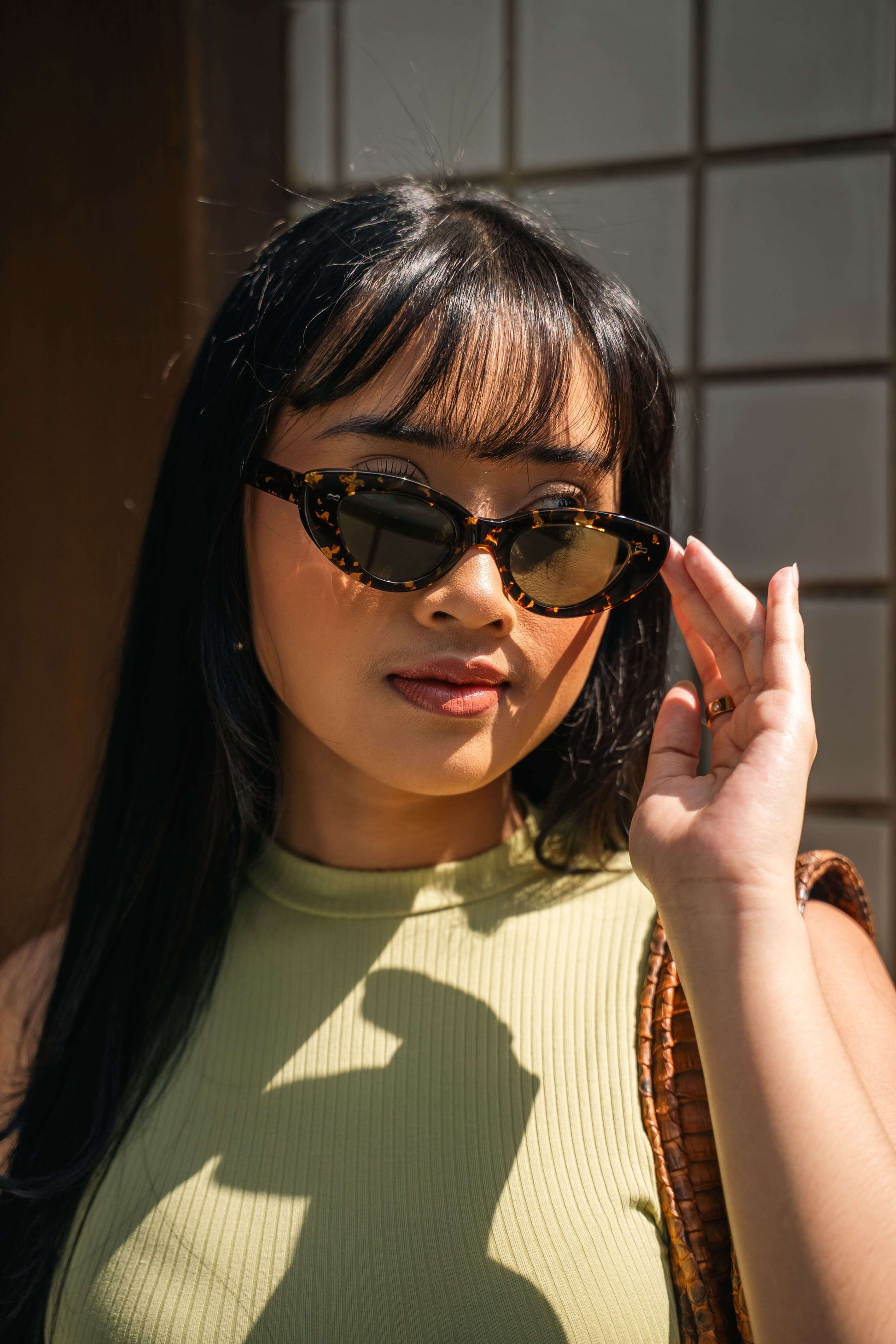 Close-up of Lombok Luxe Black Sun cat-eye sunglasses Maison Mata handmade in Bali