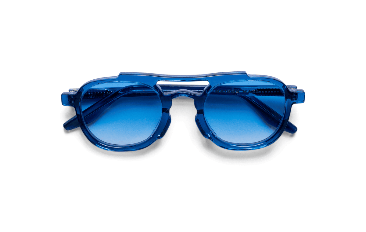 Maison Mata Mudslide translucent blue acetate aviator sunglasses, three-quarter view with blue gradient lenses