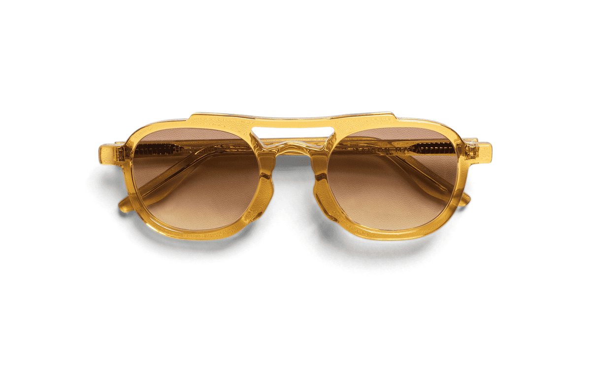 Maison Mata Mudslide translucent yellow acetate aviator sunglasses, three-quarter view with brown gradient lenses