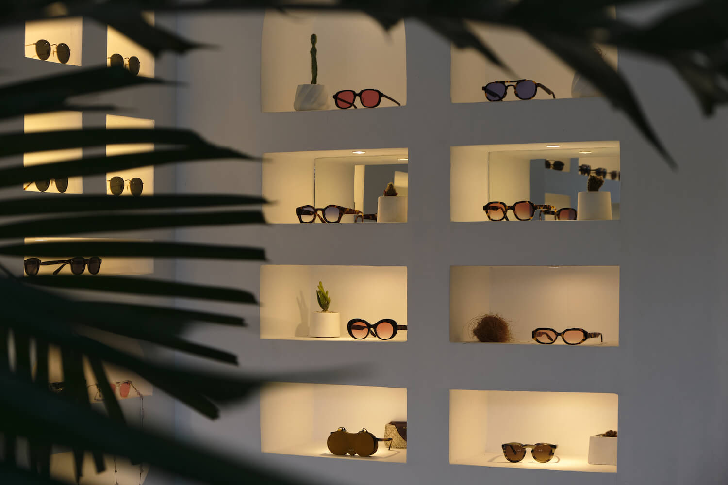 Seminyak eyewear interior featuring acetate sun frames and blue-light glasses selection.