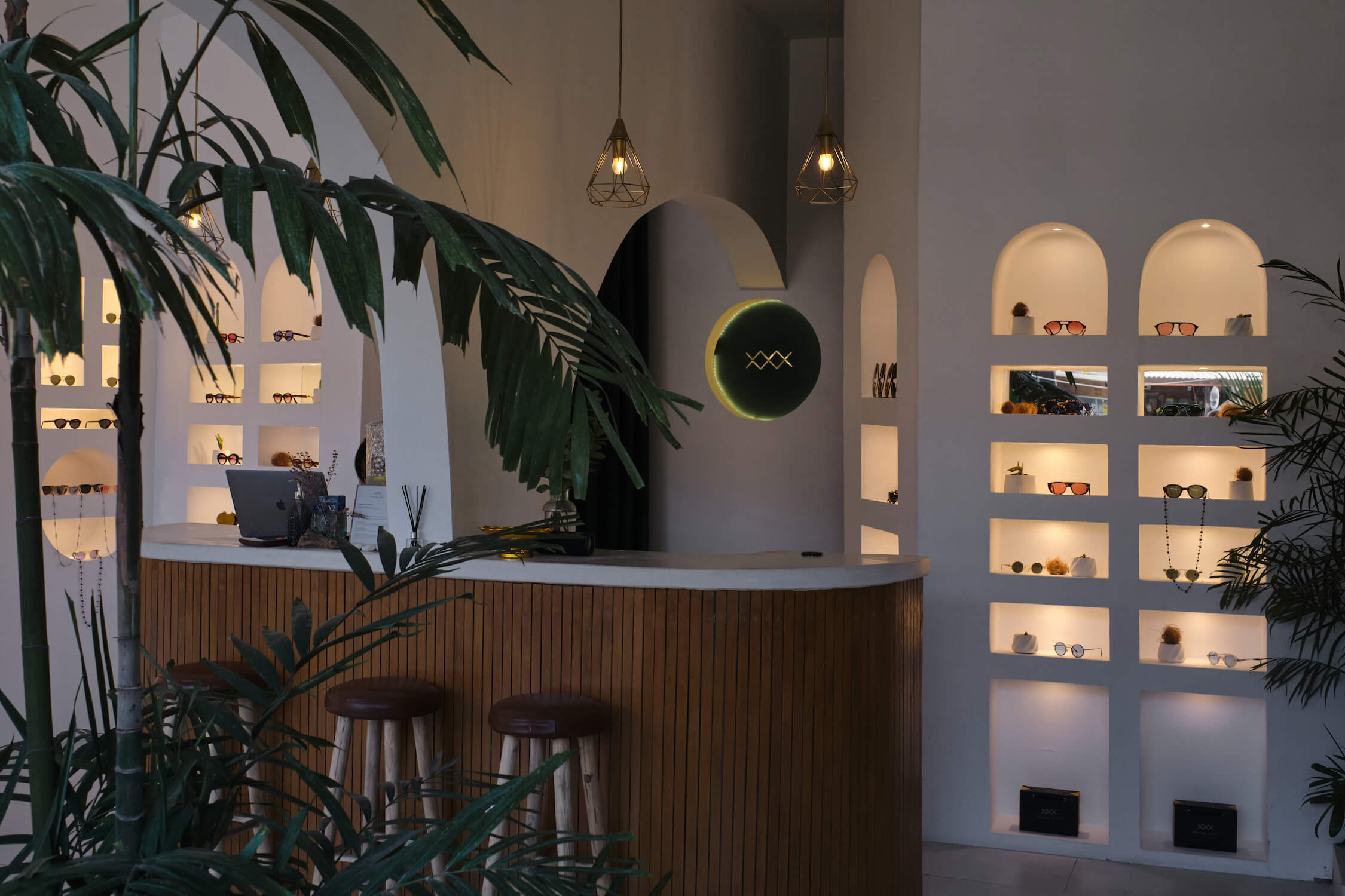 Minimalist Seminyak store wall with polarized sunglasses and optical glasses.