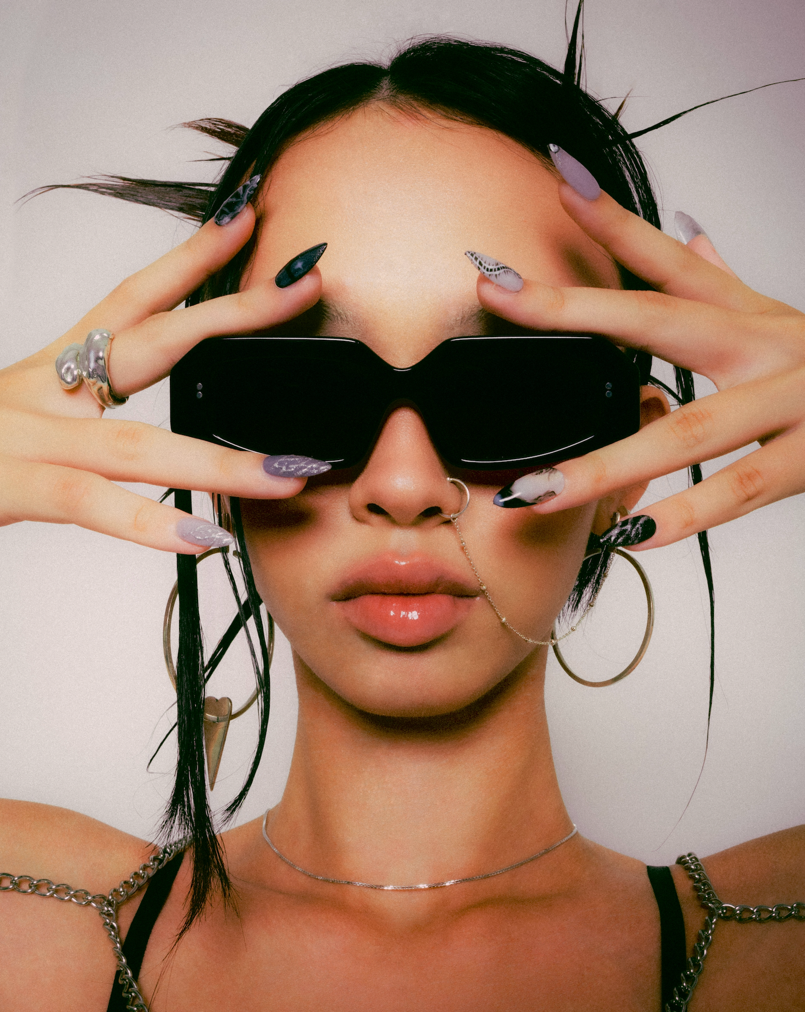 Handmade rectangular polarized sunglasses for women featured on a woman in Canggu in Bali fitted by Maison Mata opticians.