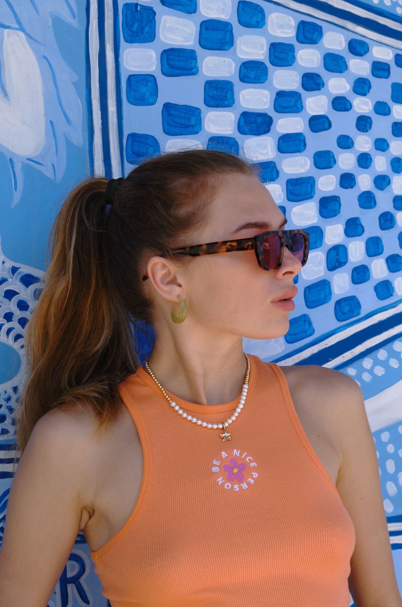 Sustainable handmade polarized aviator sunglasses featured on a woman at a Bali villa in Sanur refined by skilled optometrists.