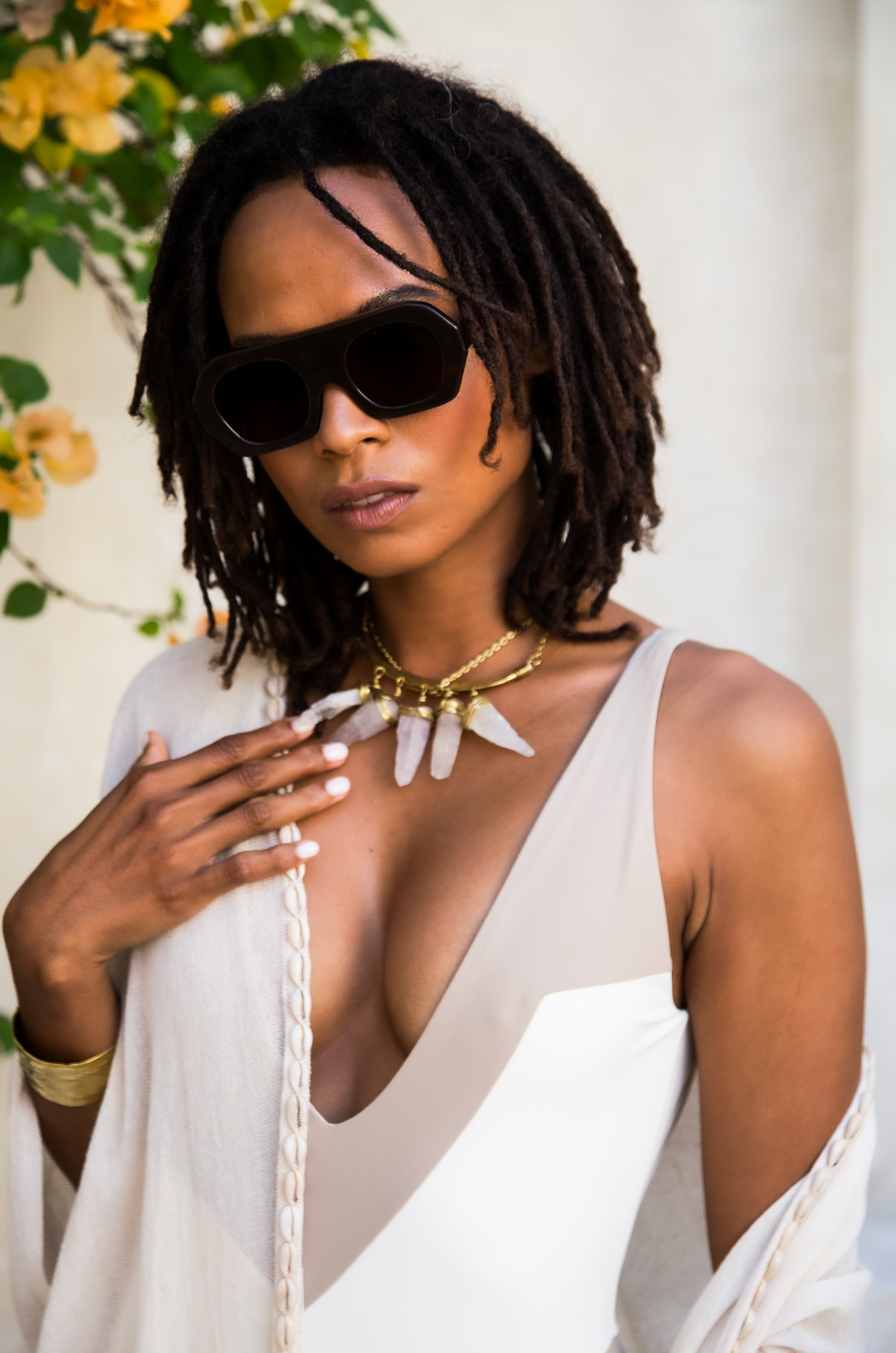 Premium handmade polarized aviator sunglasses seen on a woman near the pool in Denpasar in Bali by optometrists.