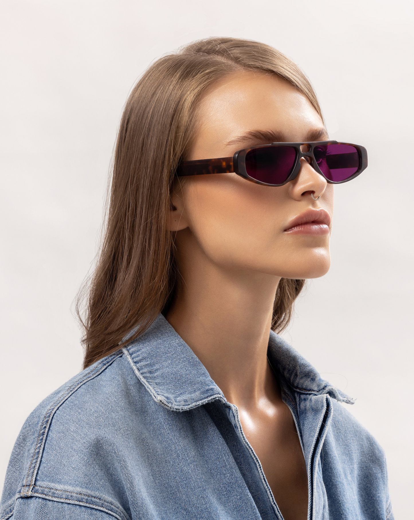 Woman shown wearing handmade polarized aviator eyewear in Canggu in Bali, designer acetate frames adjusted by expert optometrists.