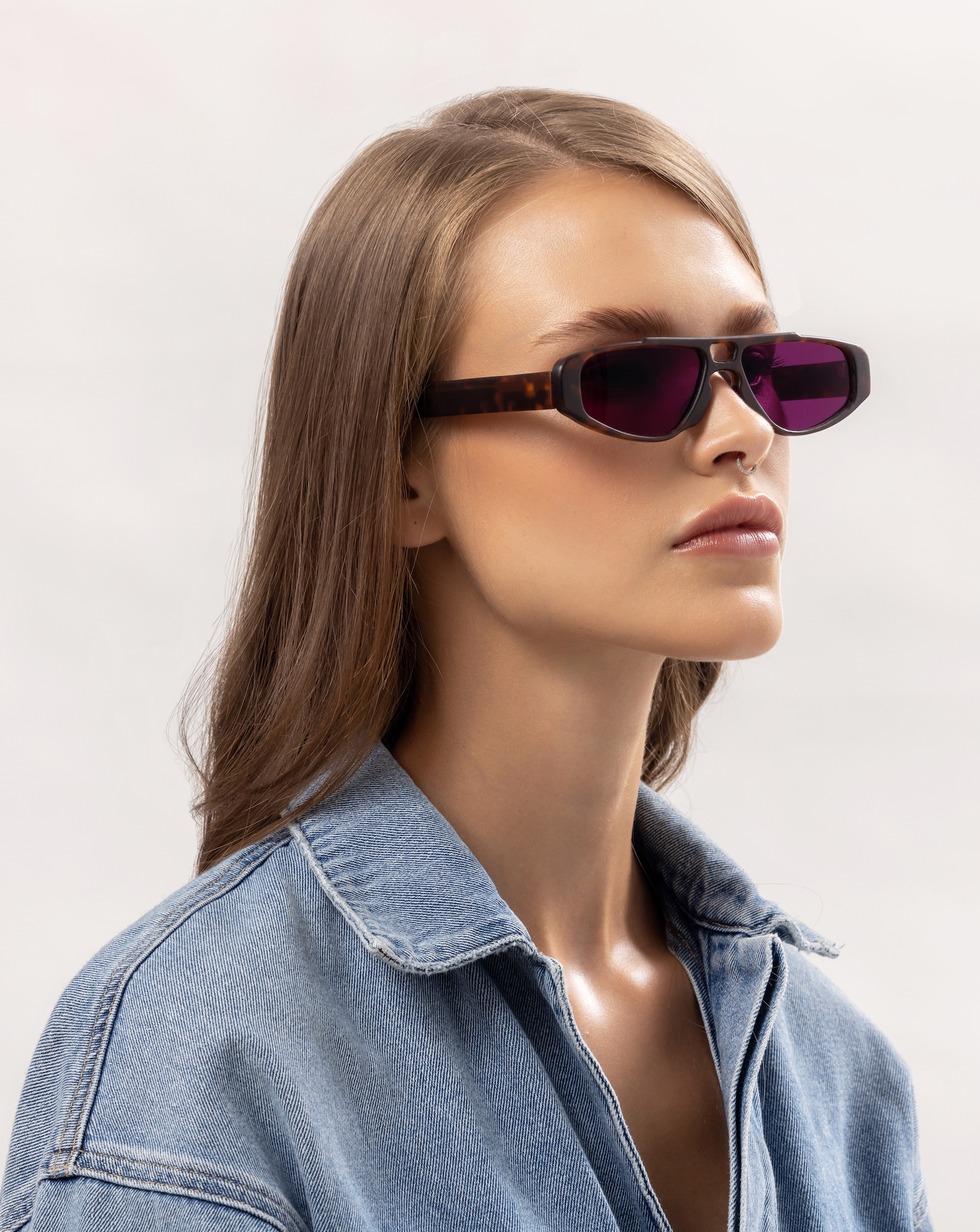 Woman shown wearing handmade polarized aviator eyewear in Canggu in Bali, designer acetate frames adjusted by expert optometrists.