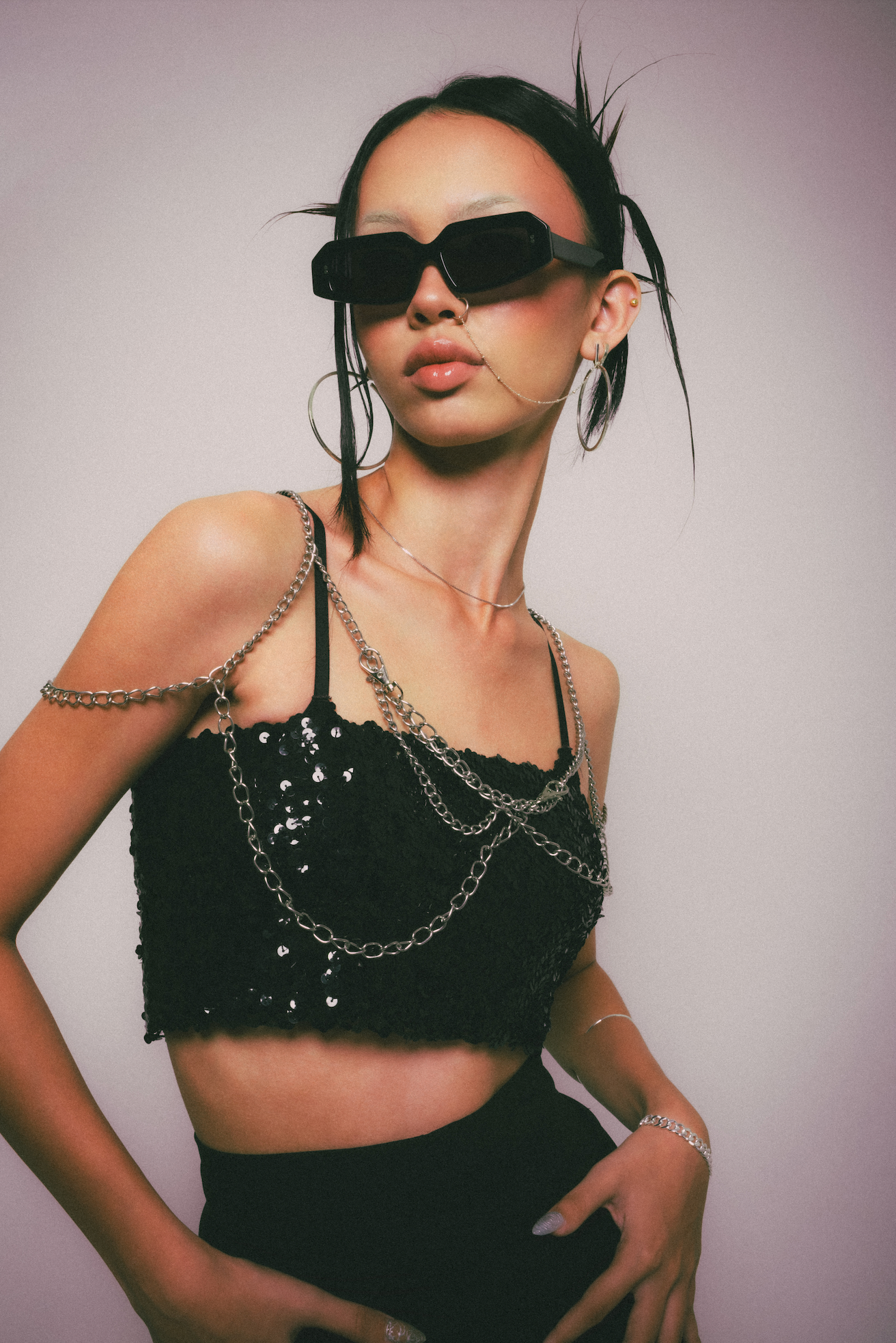 A woman captured wearing handmade rectangular polarized sunglasses in Uluwatu in Bali refined by Maison Mata optical experts.