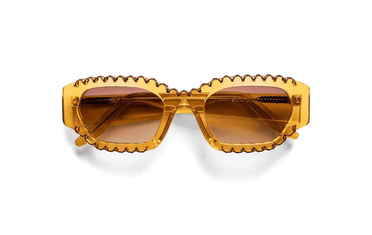 Maison Mata Tequila temptation translucent yellow acetate geometric sunglasses, three-quarter view with brown gradient lenses