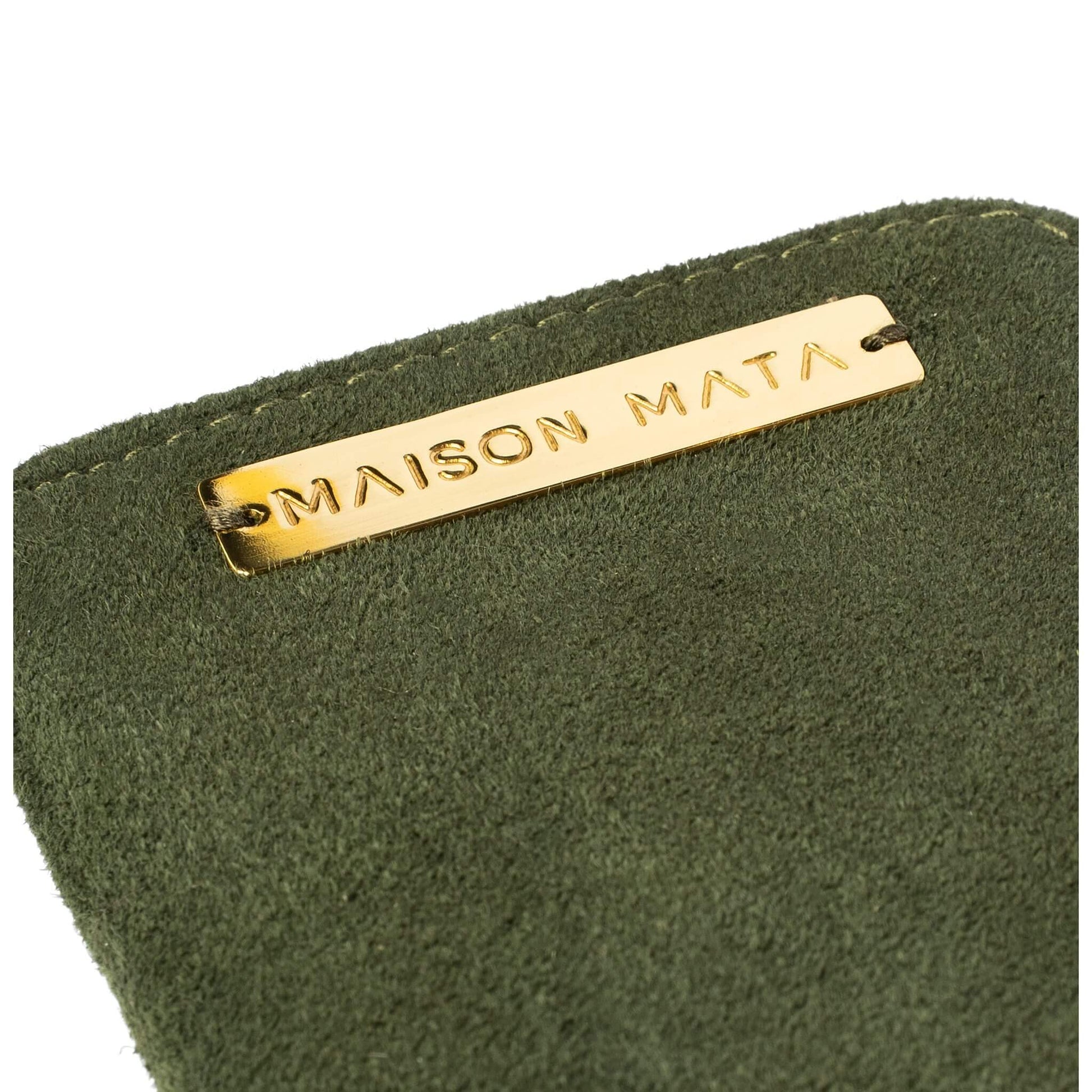 Engraved brass Maison Mata plate on the olive suede softcase