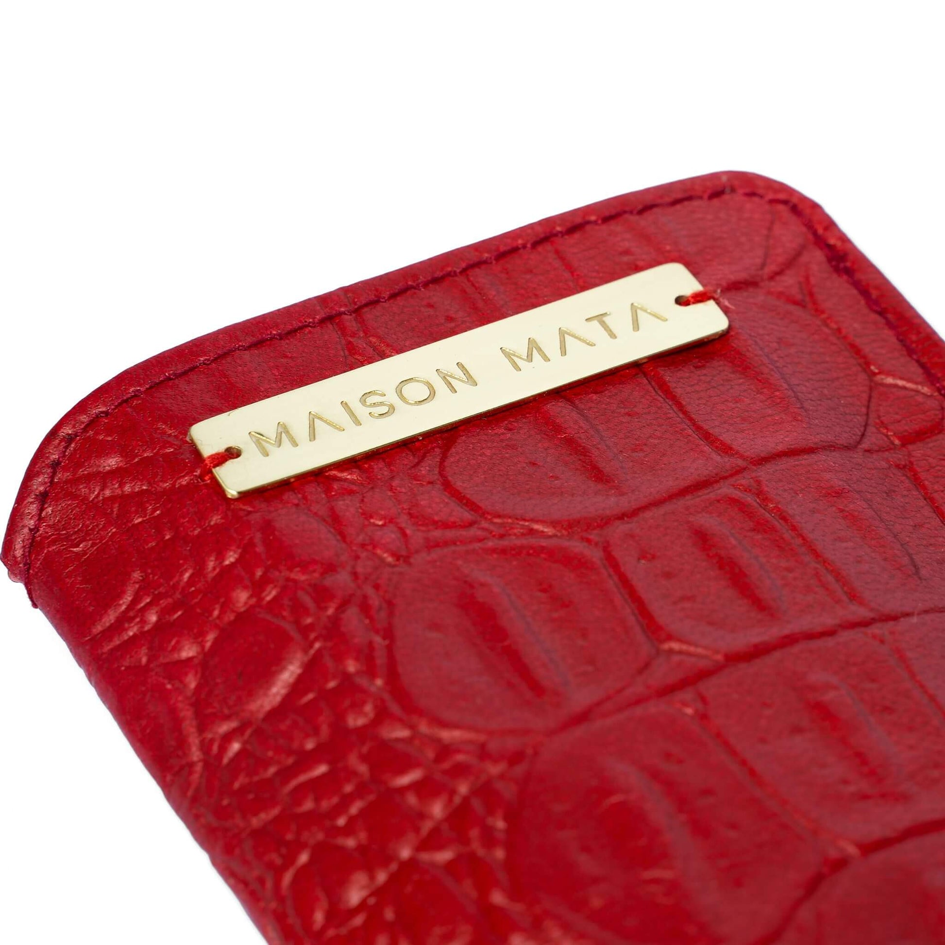 Engraved brass Maison Mata plate on the red croco softcase