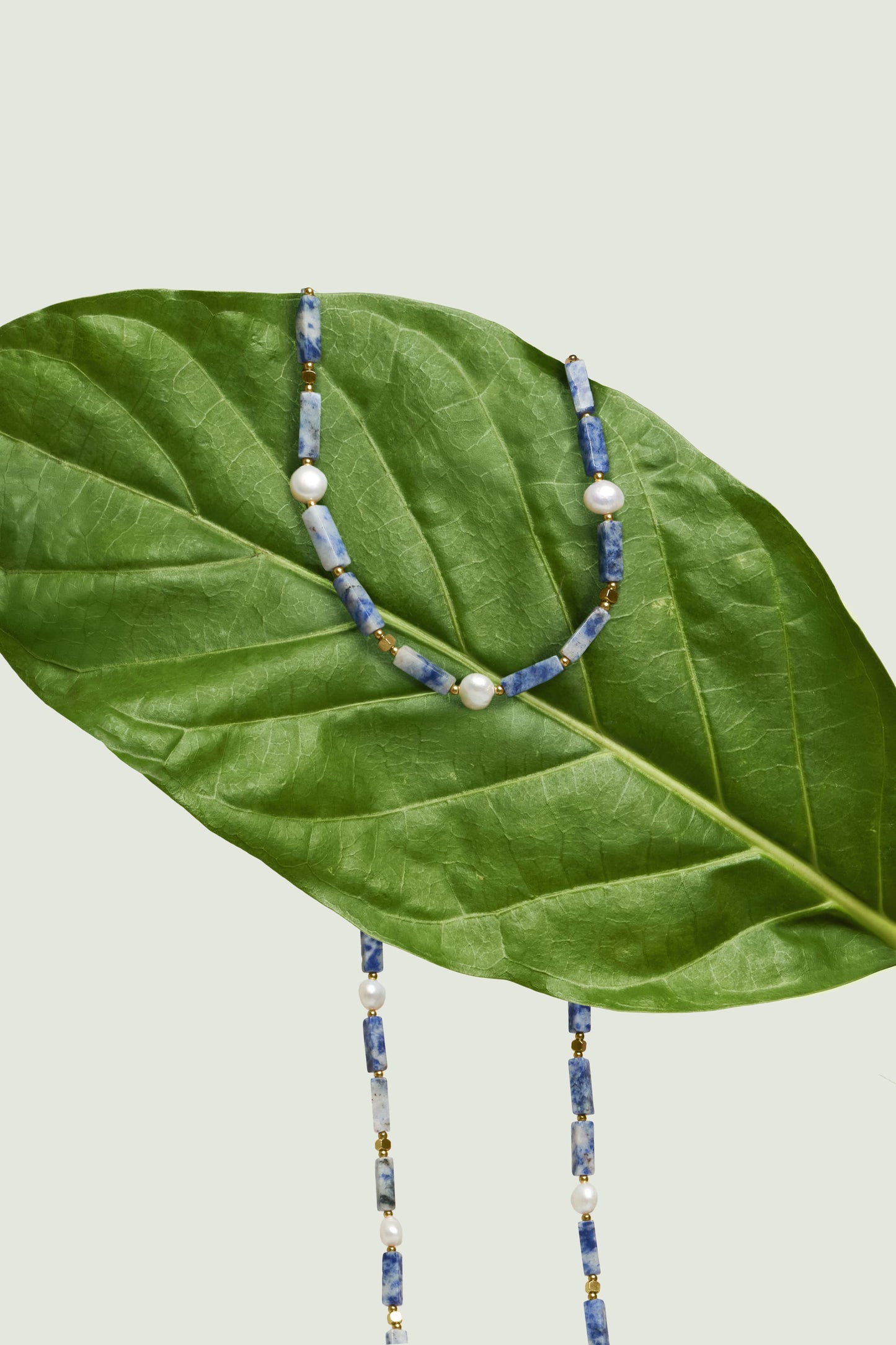 Bali artisan gold eyewear chain with stone, a chic accessory for Maison Mata frames.