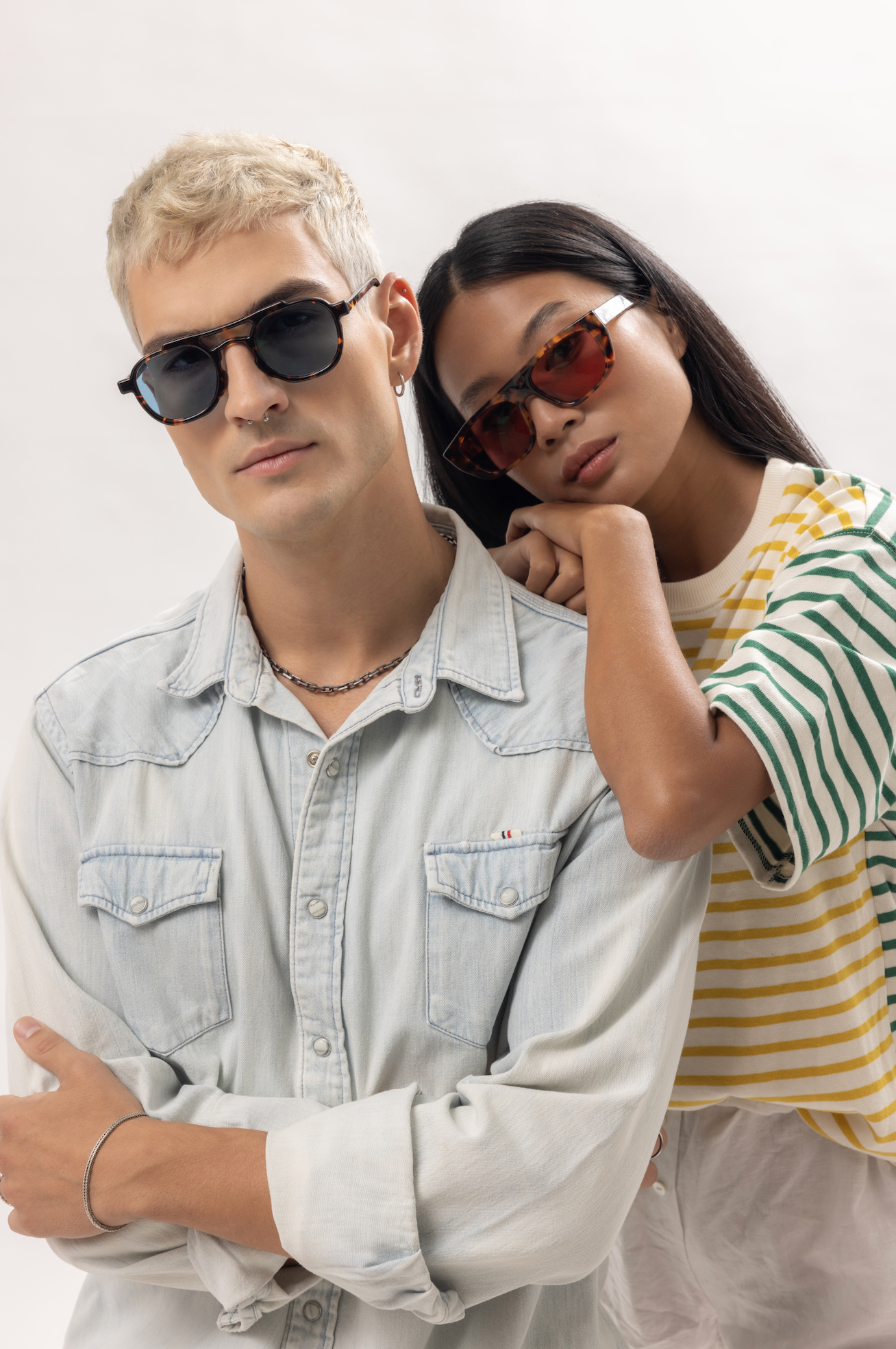 Handcrafted sunglasses for couples showcased outdoors in Seminyak in Bali, acetate build adjusted by professional opticians.
