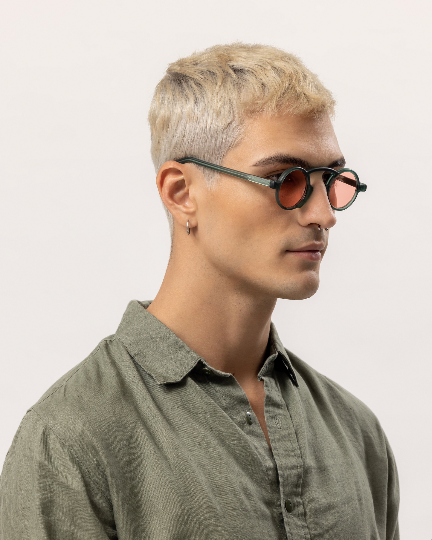 Custom handmade polarized acetate sunglasses for men highlighted near the waves of Amed in Bali by experienced optometrists.