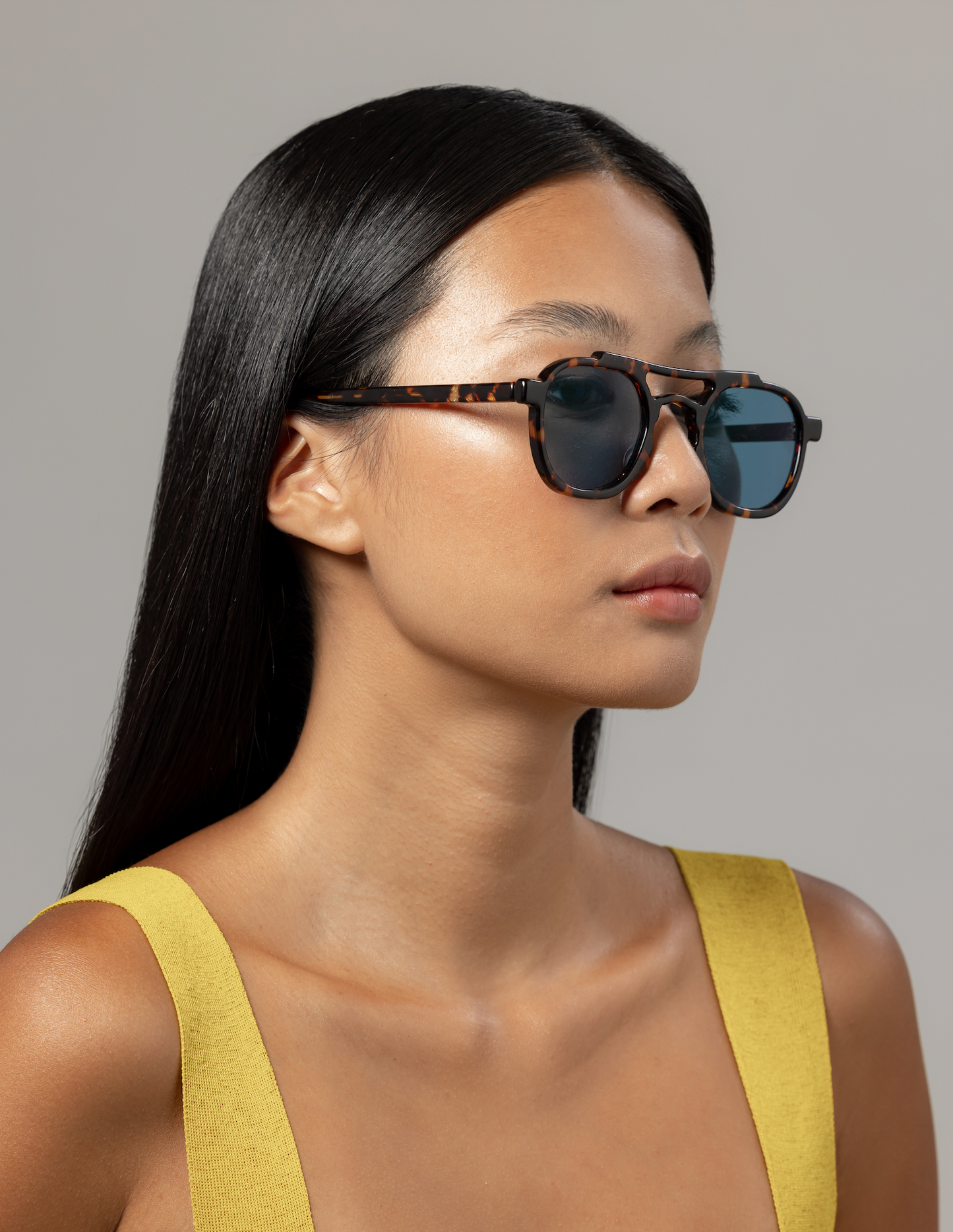 Sustainable handmade eyewear with blue-light lenses worn by a woman in Seminyak in Bali adjusted by optical specialists.